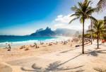 Palms and Two Brothers Mountain on Ipanema beach in Rio de Janeiro. Brazil. Ipanema beach in Rio de Janeiro